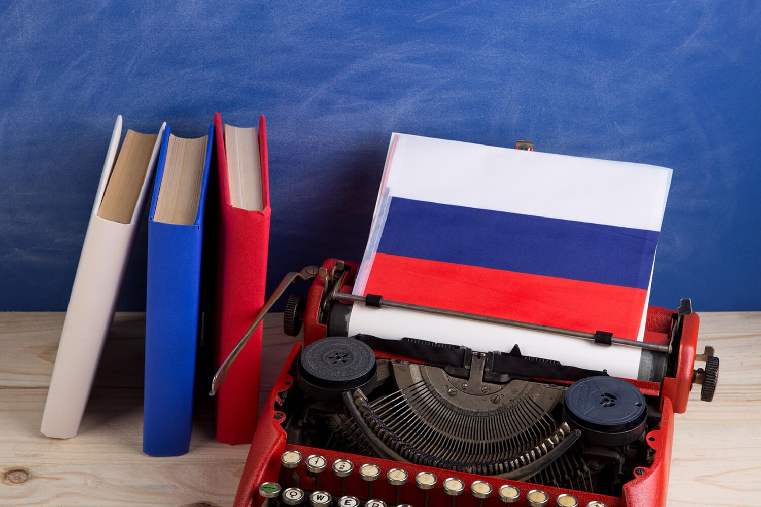 Russian flag, books and typewriter